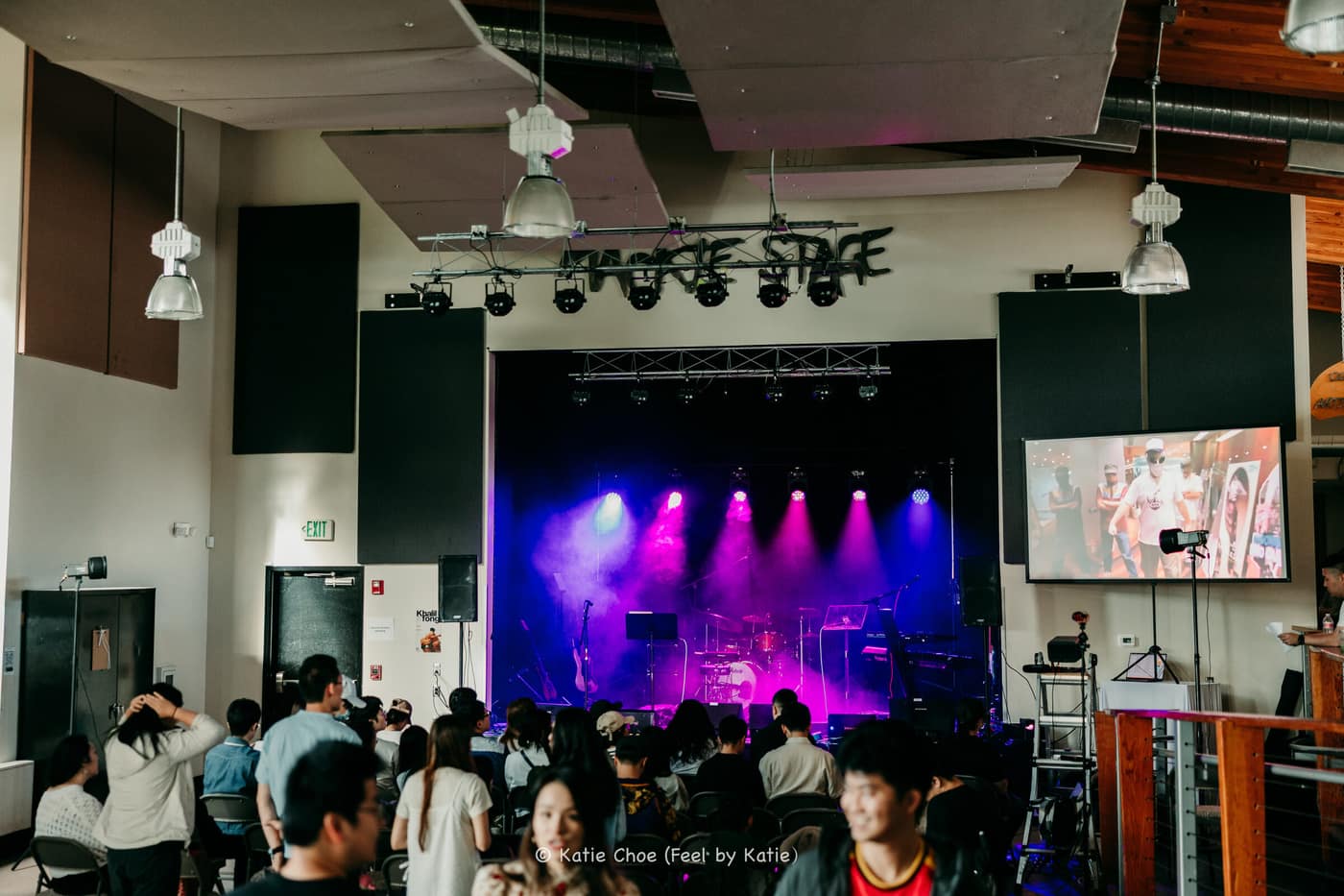 Cuebeam's ground-supported truss rig lit in violet and blue, the same system used for corporate events, weddings, and live shows